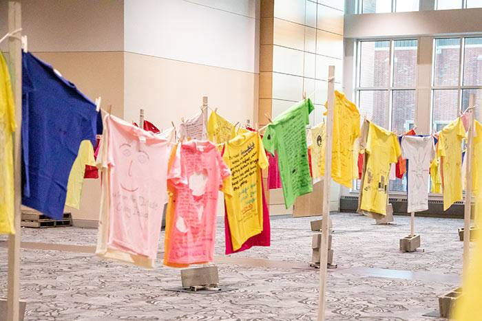 tshirts hanging at the clothesline project