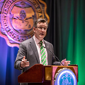 Dr. Armacost speaking at podium