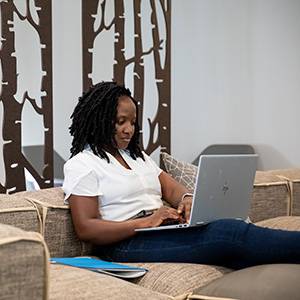 online student working on laptop