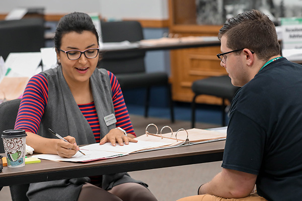 advisor working with student