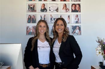 Brea Binstock and Ashley Froemke standing in their salon, Lovely Lash Company in Fargo, ND