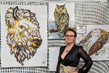 Jessica Erhart standing in front of her Master of None Artistry in Spearfish, SD