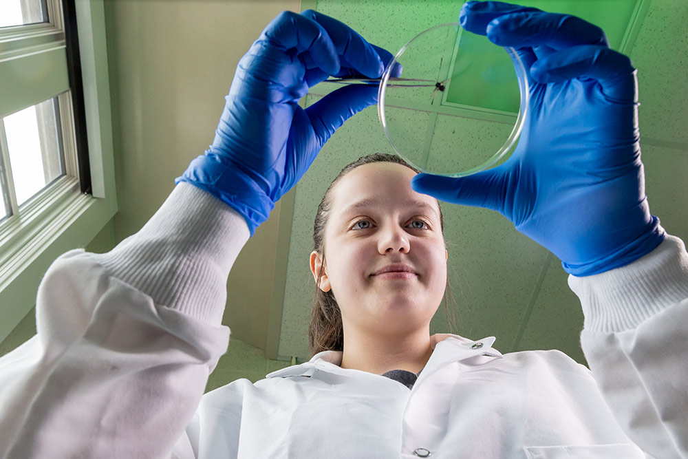 nicolette ras examining evidence in lab