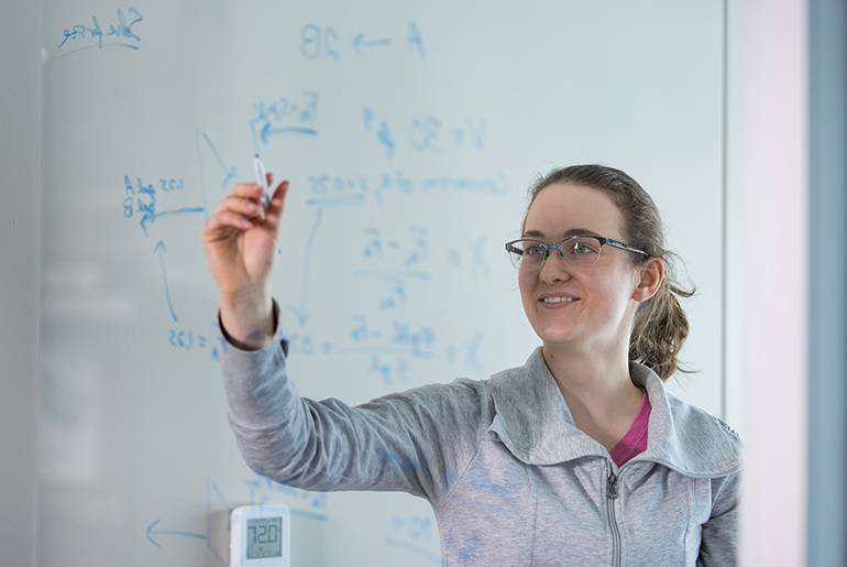 Student looks at equations