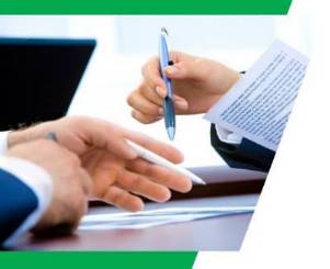 Two businesses people discussing paperwork with their hands and signing contracts