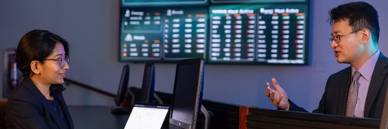 applied economics masters students presenting in class