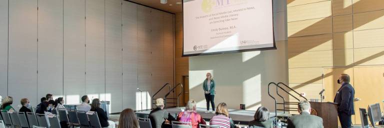 communication phd student presenting research