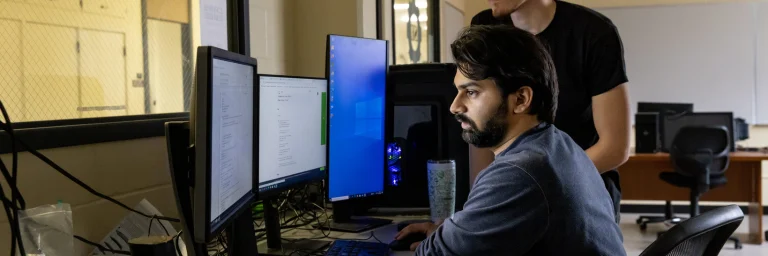 information systems student on computer