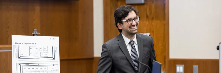 law student presenting Exhibit 9 in court room