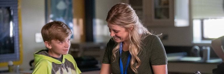 middle level education student and teacher in lab