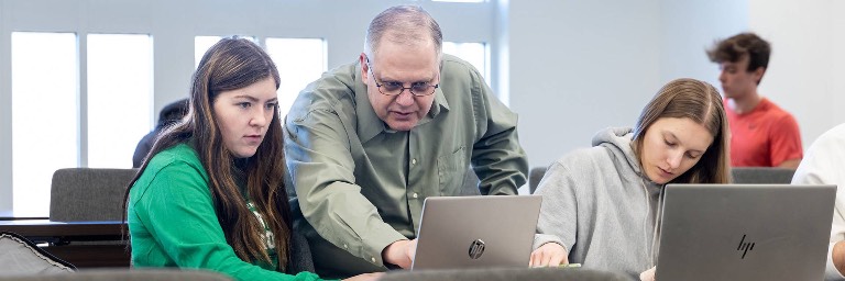 professor with operations management degree student