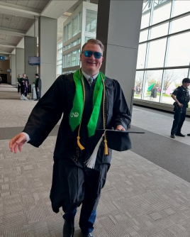 UND Commencement student after graduation